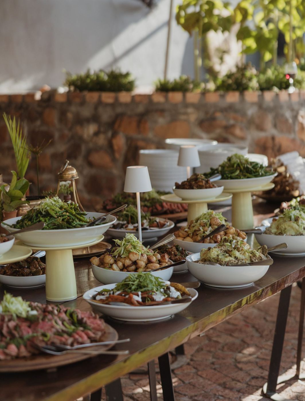 Buffet of salads and platters on a long table