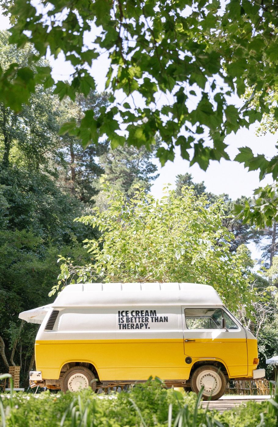 Vintage yellow van at a garden event