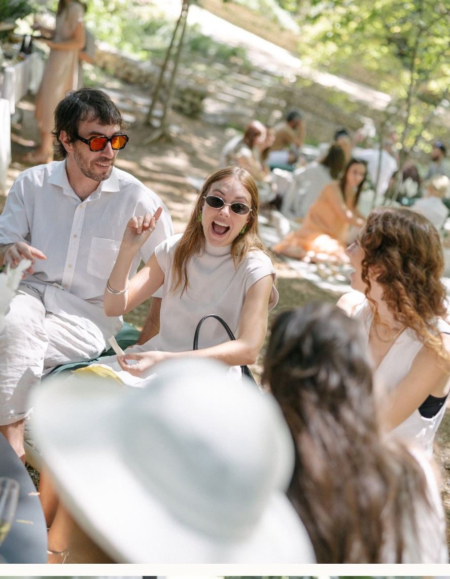 Guests celebrating at an outdoor welcome party