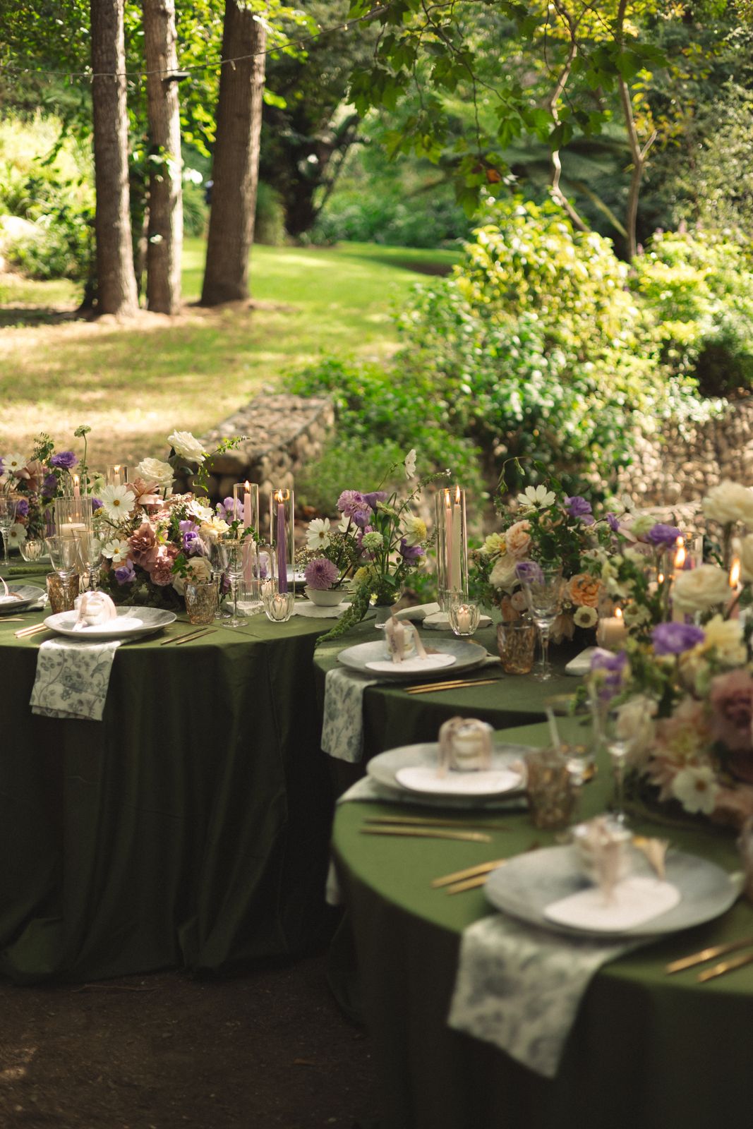 Round tables set among the trees
