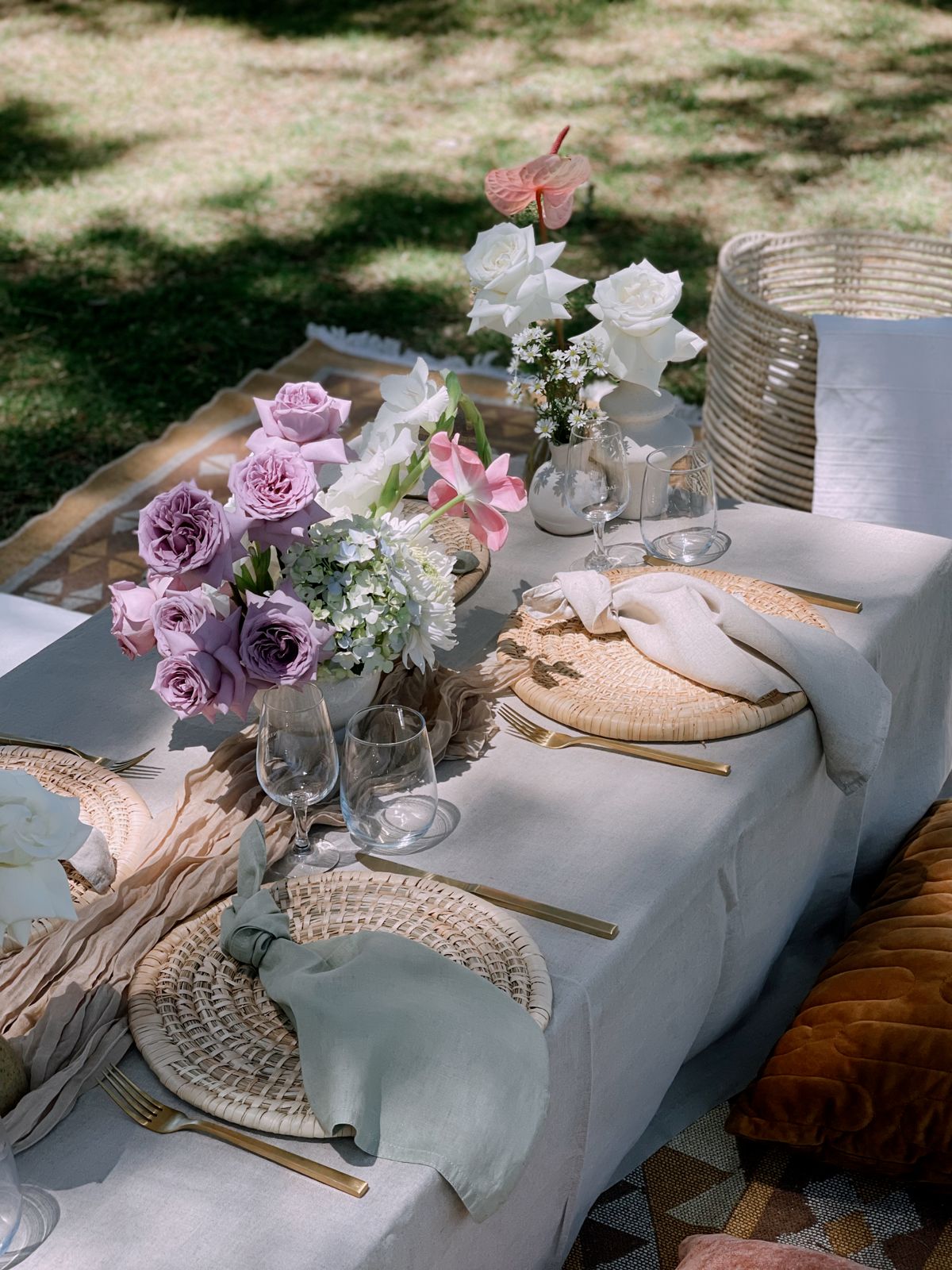 Low picnic table with lilac florals and floor cushions